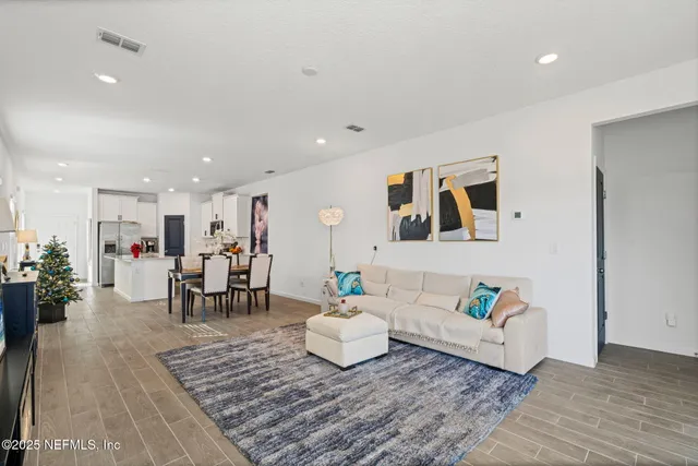 a en suite bathroom with a double vanity sink and a mirror