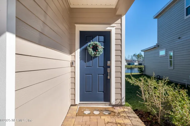 a very nice looking dining room with kitchen island furniture and a chandelier