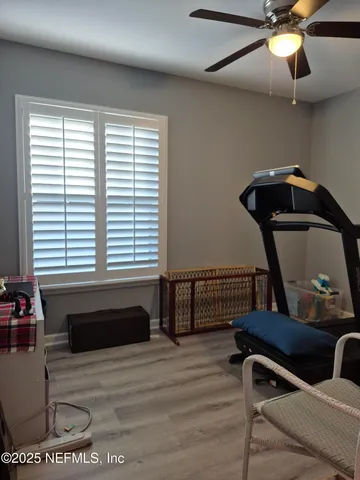 a bedroom with furniture and window