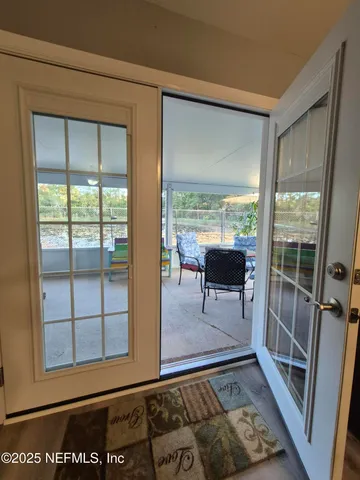 a view of livingroom with furniture and front door