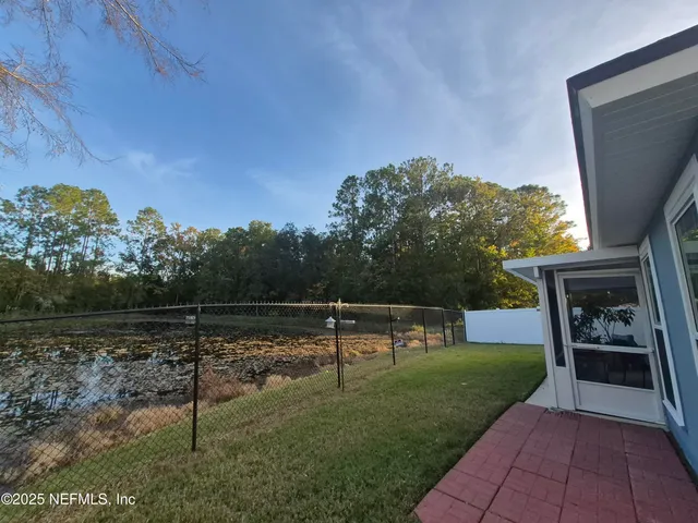 a view of swimming pool with a yard