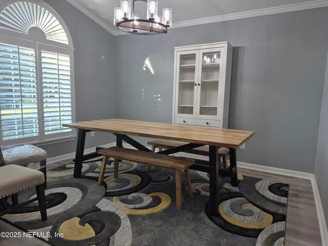 a view of a dining room with furniture window and outside view