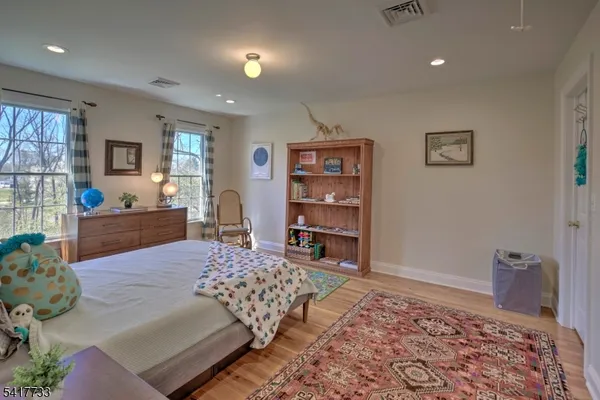 a bedroom with a bed and a couch