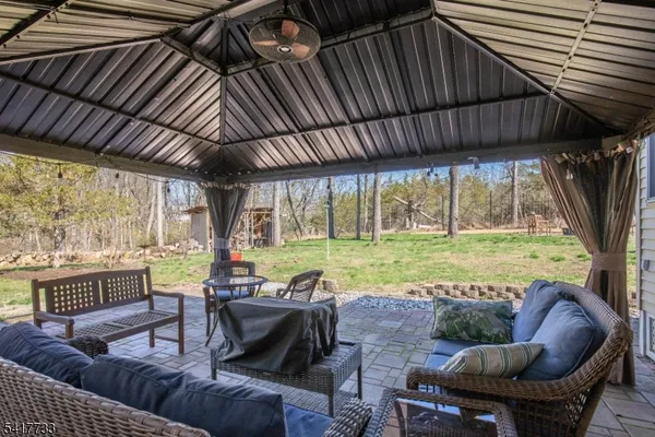 a outdoor living space with furniture and garden view
