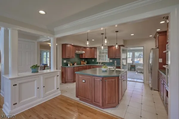 a kitchen with a sink and cabinets