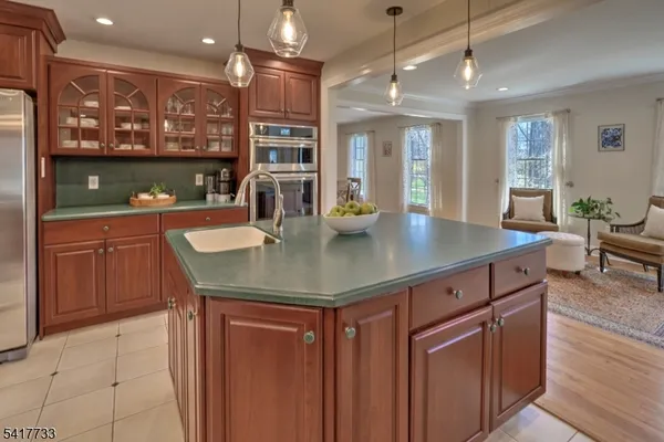 a view of kitchen island a sink and living room