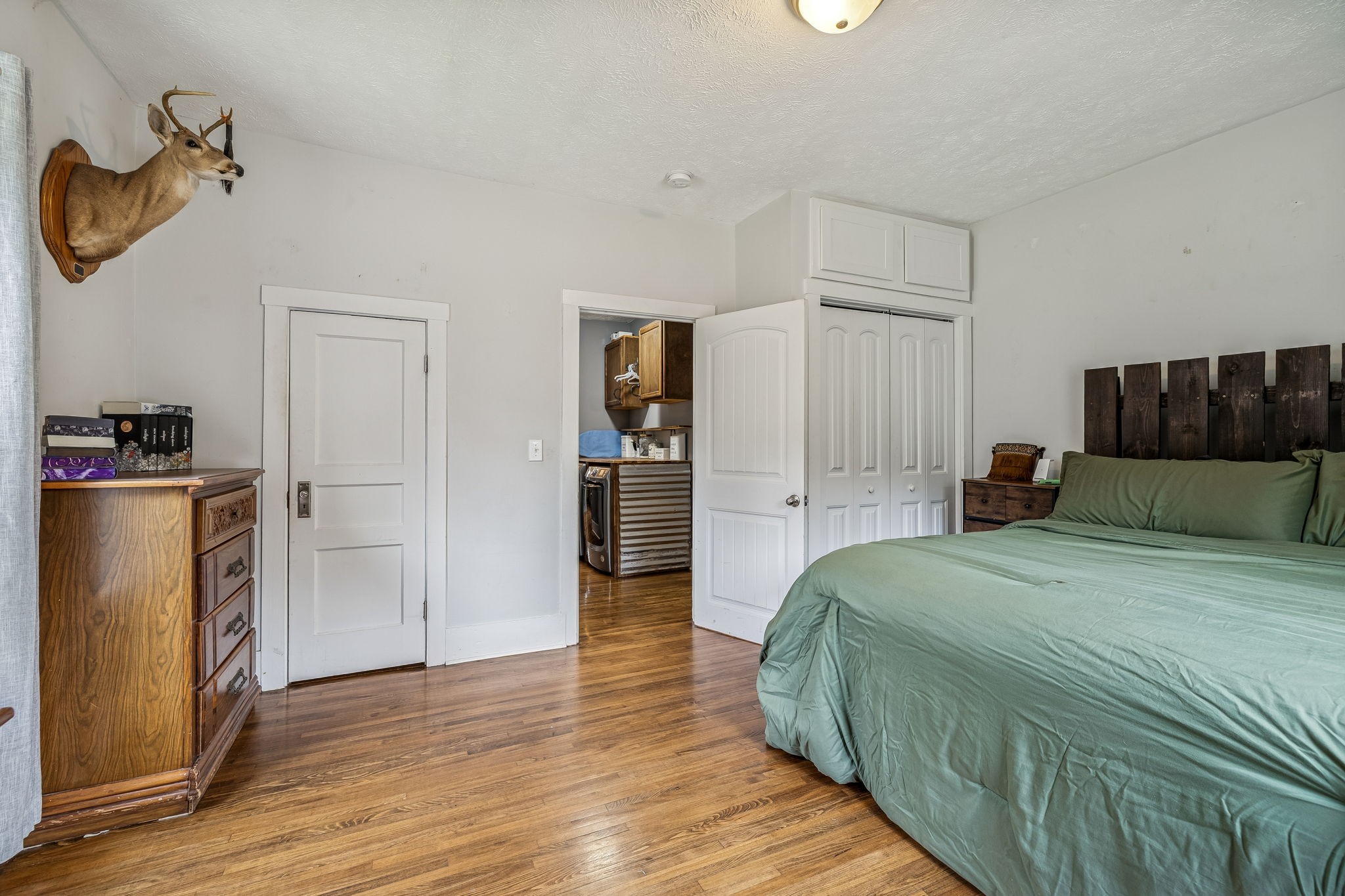 147 Sloan Branch Road Pleasant Shade, TN 37145 - Photo 30 of 53 a spacious bedroom with a bed and a refrigerator