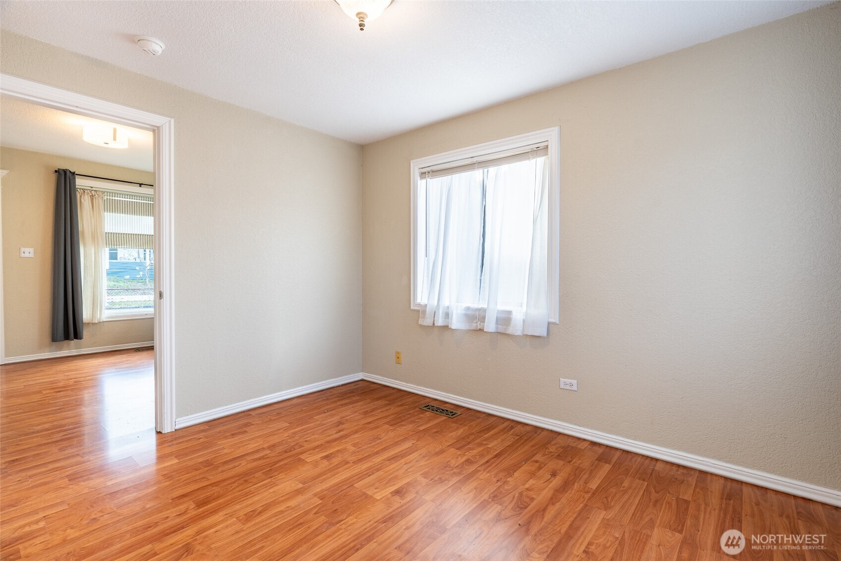 3584 East K Street Tacoma, WA 98404 - Photo 13 of 30 wooden floor in an empty room with a window