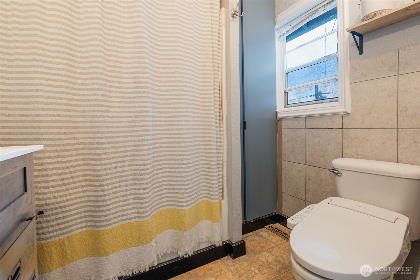 3584 East K Street Tacoma, WA 98404 - Photo 20 of 30 a bathroom with a toilet and bathtub