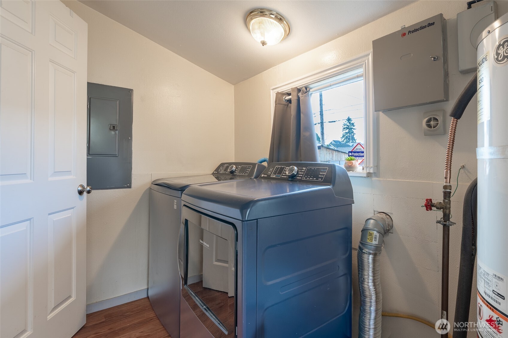 3584 East K Street Tacoma, WA 98404 - Photo 21 of 30 a utility room with cabinets washer and dryer