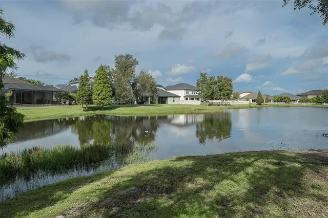 a bedroom with furniture and a large window