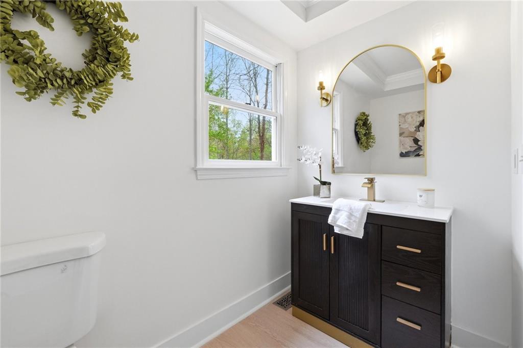 2955 Brookfield Circle Cumming, GA 30040 - Photo 21 of 89 a bathroom with a sink and a mirror