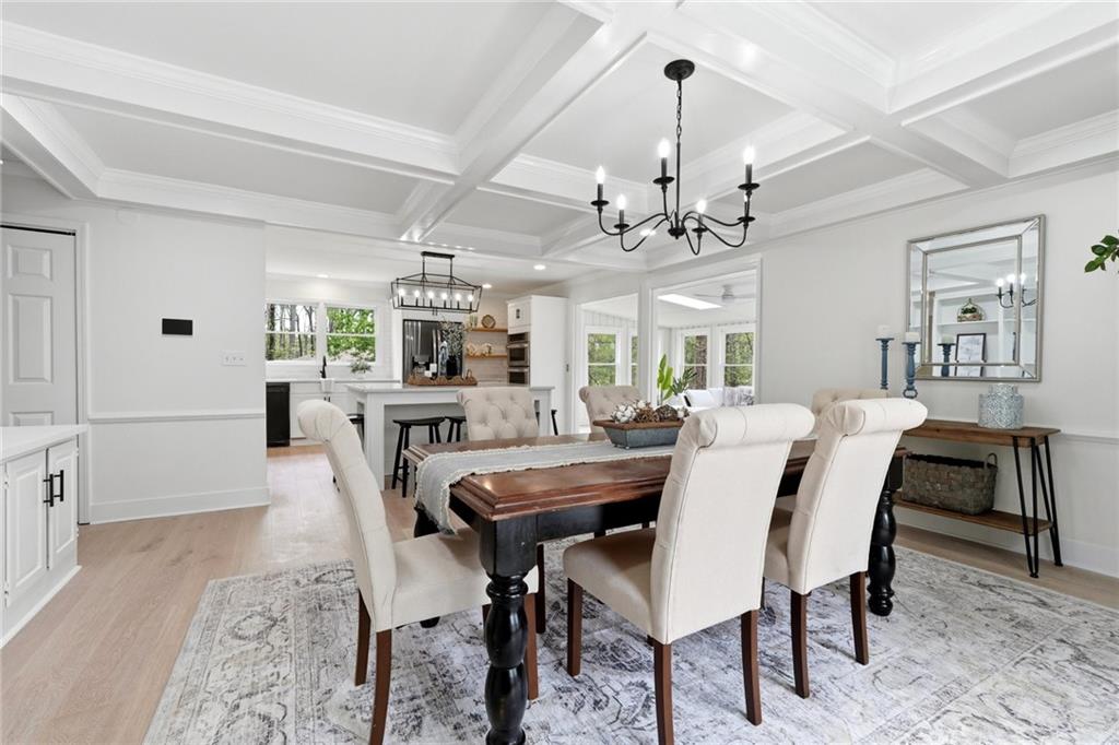 2955 Brookfield Circle Cumming, GA 30040 - Photo 30 of 89 a view of a dining room with furniture and a chandelier