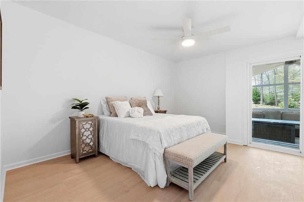 2955 Brookfield Circle Cumming, GA 30040 - Photo 45 of 89 a spacious bedroom with a bed and a window