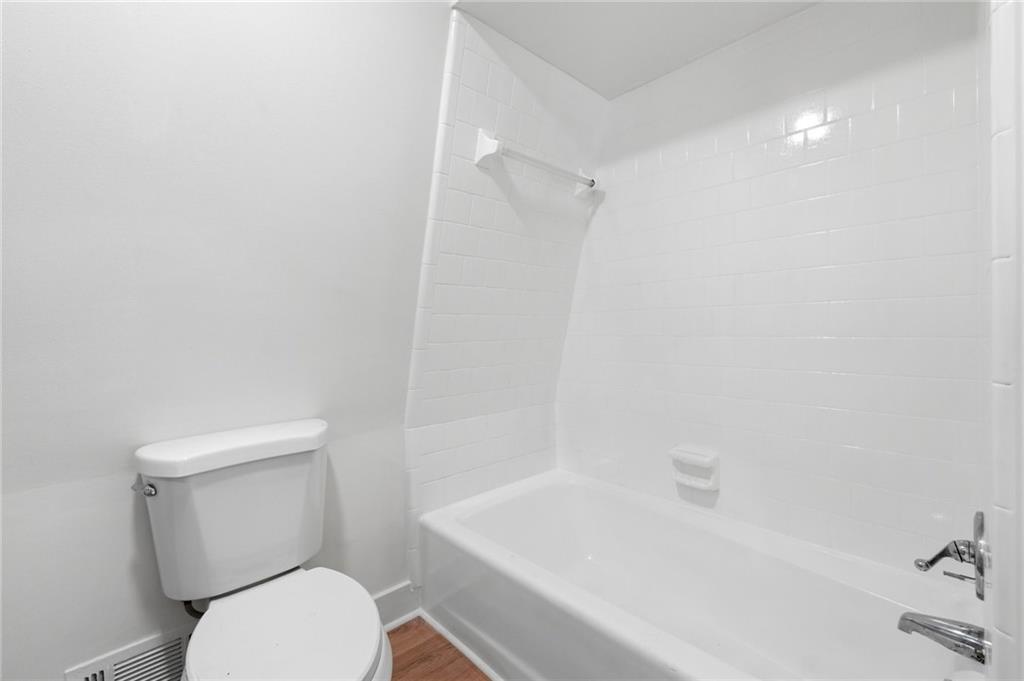 2955 Brookfield Circle Cumming, GA 30040 - Photo 47 of 89 a white toilet sitting next to a bath tub