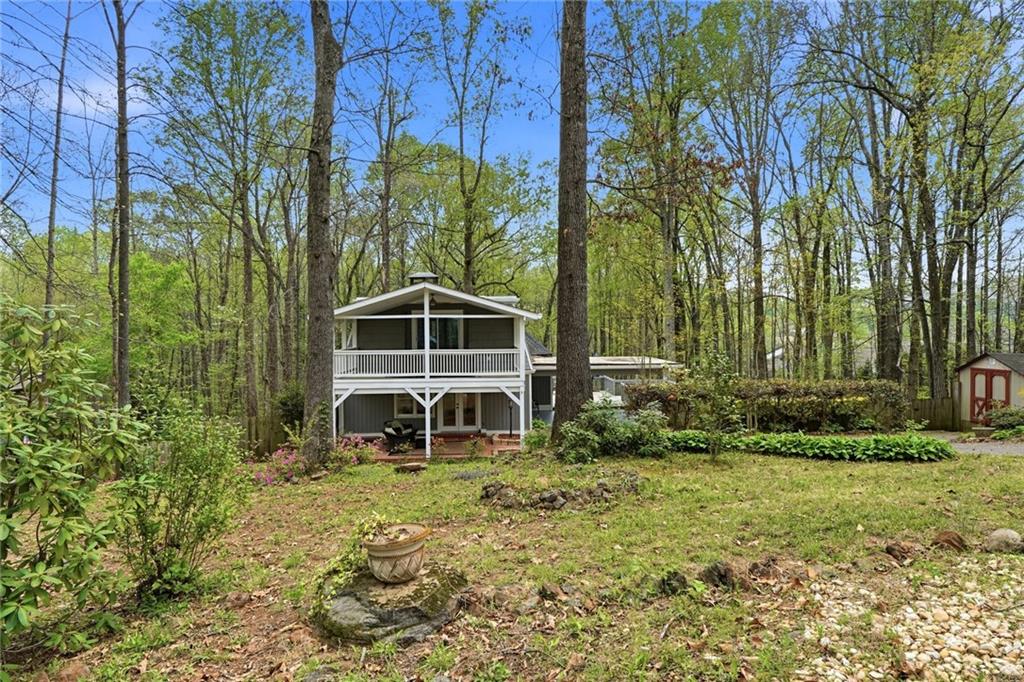 2955 Brookfield Circle Cumming, GA 30040 - Photo 6 of 89 a front view of a house with garden