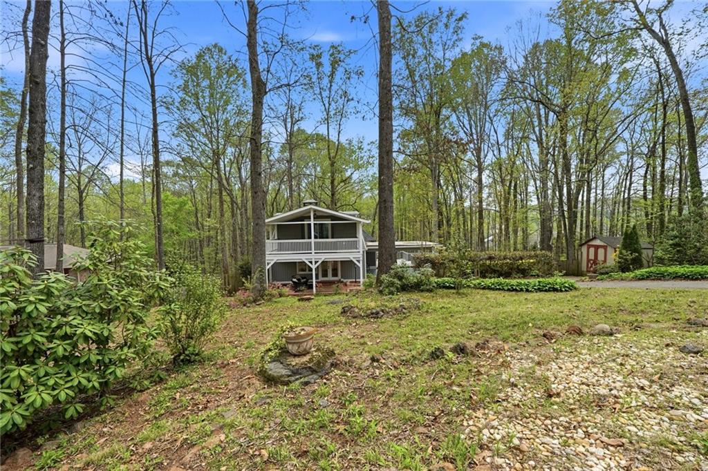 2955 Brookfield Circle Cumming, GA 30040 - Photo 7 of 89 a backyard of a house with lots of green space