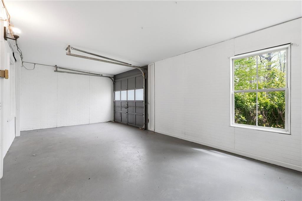 2955 Brookfield Circle Cumming, GA 30040 - Photo 88 of 89 a view of a big room with windows and chandelier fan