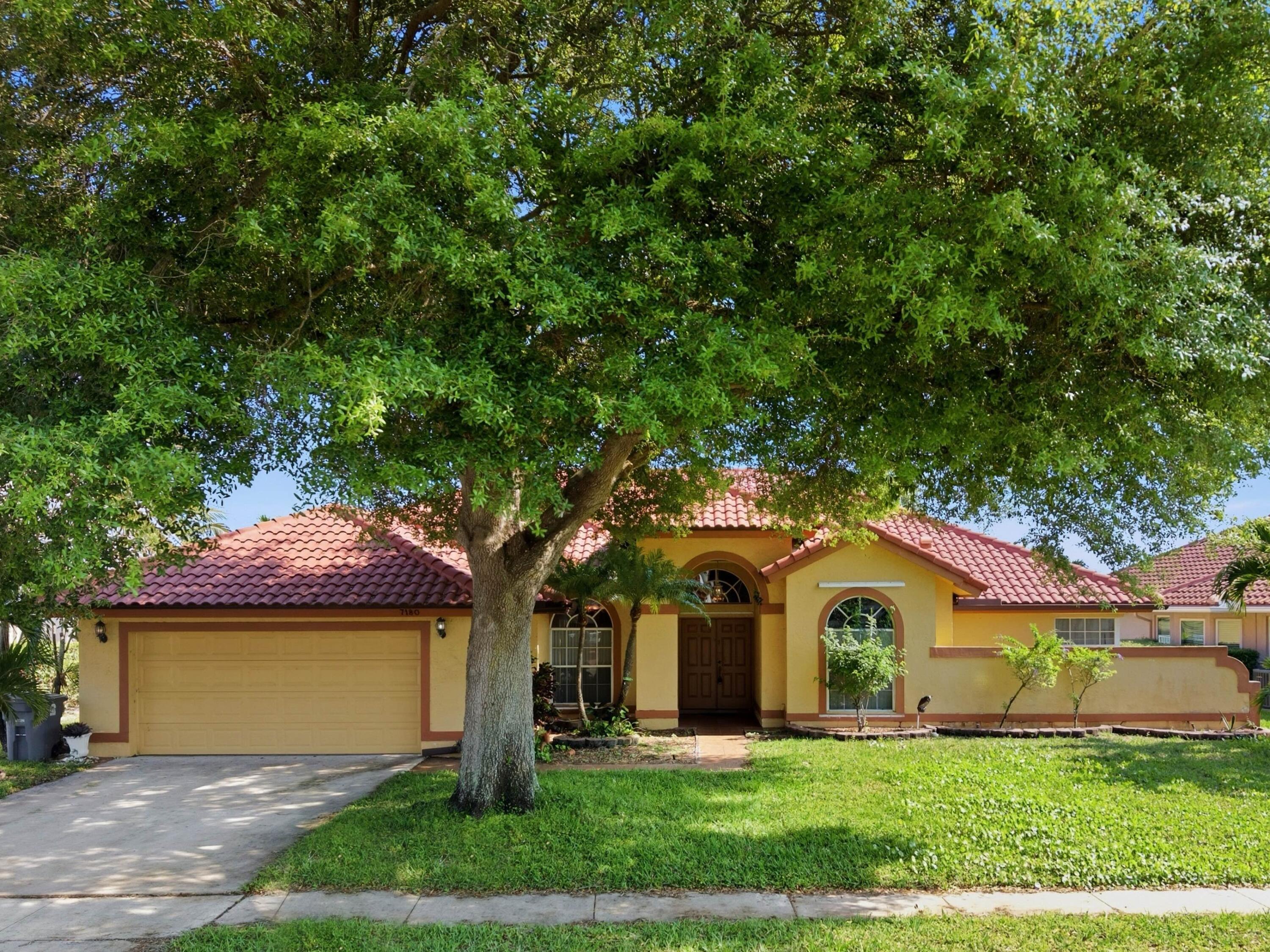 7180 Lockwood Road Lake Worth, FL 33467 - Photo 2 of 54 Front