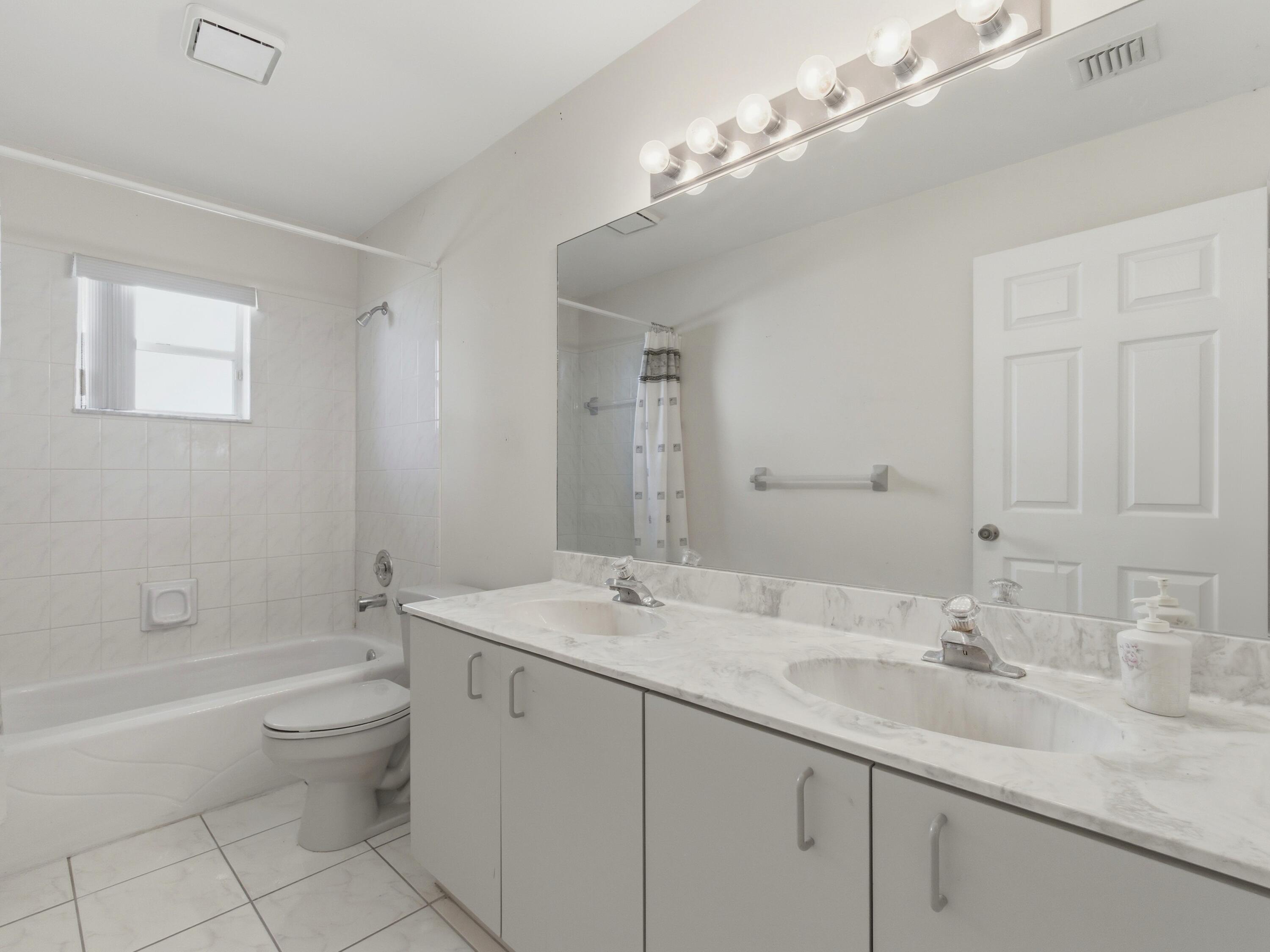 7180 Lockwood Road Lake Worth, FL 33467 - Photo 33 of 54 Guest Bathroom