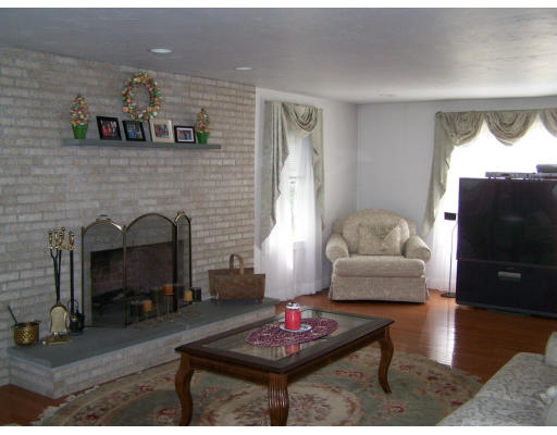 223 County Road Rochester, MA 02576 - Photo 3 of 25 a living room with furniture and a fireplace