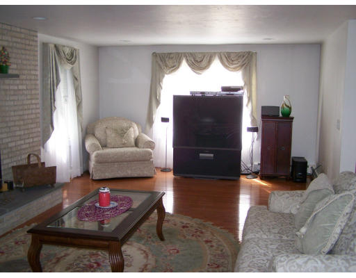 223 County Road Rochester, MA 02576 - Photo 4 of 25 a living room with furniture a window and a fireplace
