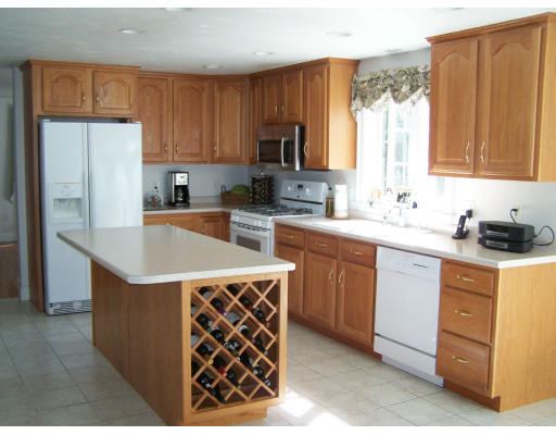 223 County Road Rochester, MA 02576 - Photo 8 of 25 a kitchen with a sink a stove and refrigerator