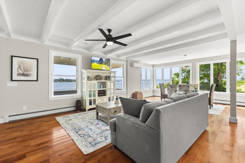 1366 Gardners Neck Road Swansea, MA 02777 - Photo 11 of 35 a living room with furniture and a large window