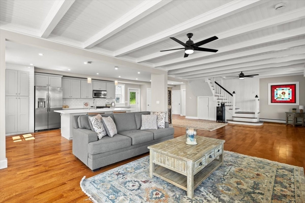 1366 Gardners Neck Road Swansea, MA 02777 - Photo 12 of 35 a living room with furniture and a wooden floor