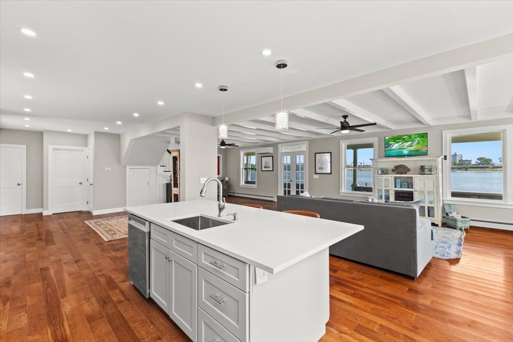 1366 Gardners Neck Road Swansea, MA 02777 - Photo 19 of 35 a kitchen with stainless steel appliances granite countertop a sink and a stove