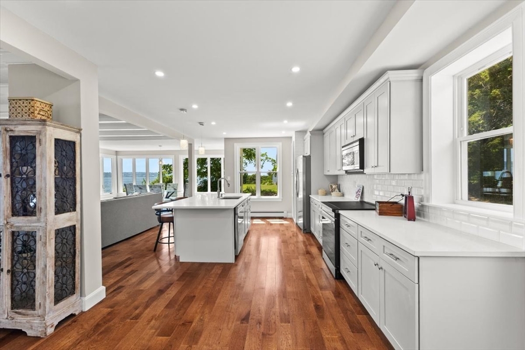 1366 Gardners Neck Road Swansea, MA 02777 - Photo 21 of 35 a kitchen with a sink and wooden floor
