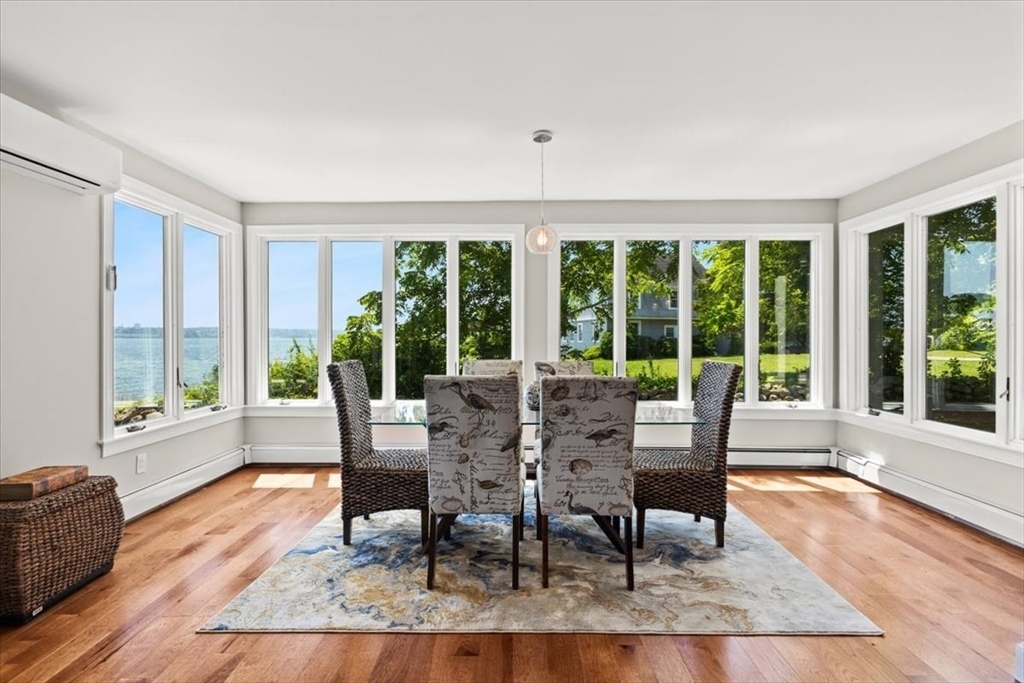 1366 Gardners Neck Road Swansea, MA 02777 - Photo 23 of 35 a view of a dining room with furniture window and wooden floor