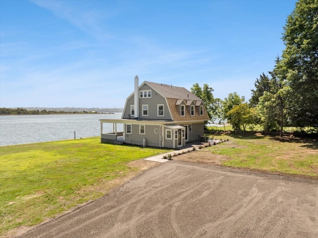1366 Gardners Neck Road Swansea, MA 02777 - Photo 27 of 35 a view of a house with outdoor space and ocean view