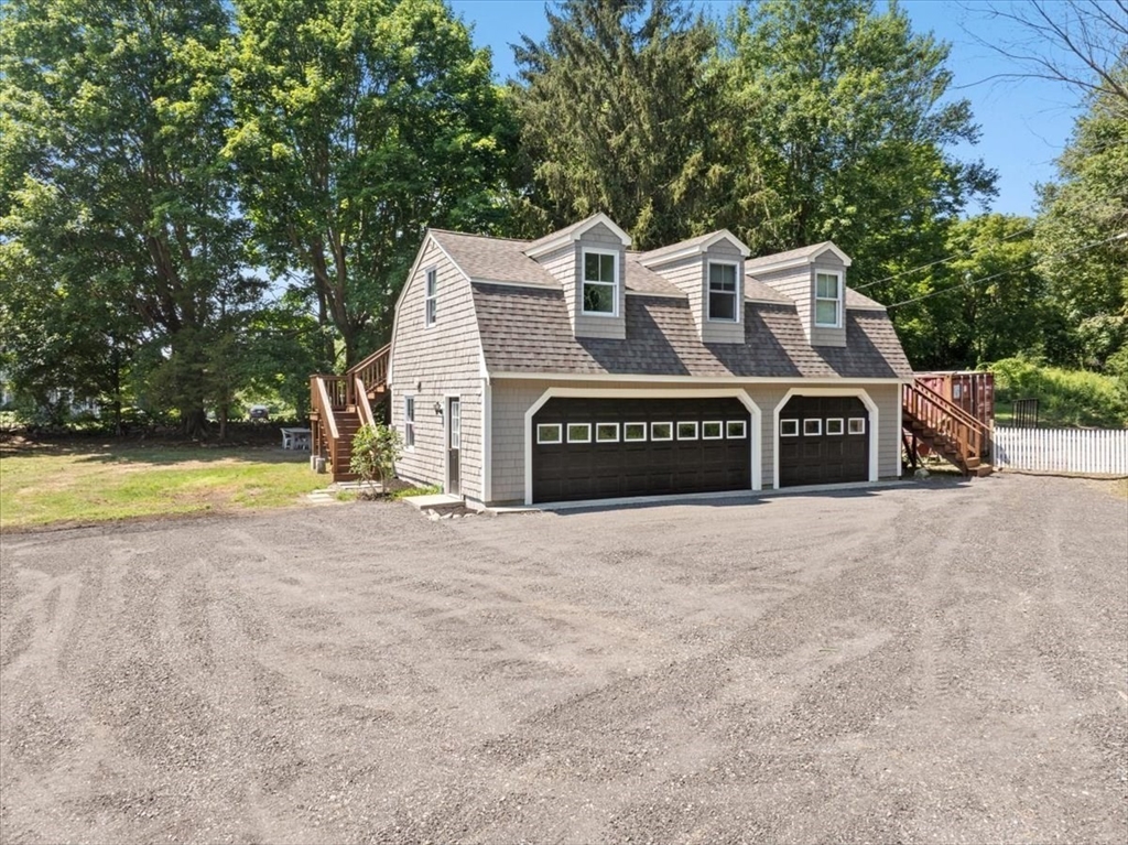 1366 Gardners Neck Road Swansea, MA 02777 - Photo 28 of 35 a view of a house with a yard and large trees