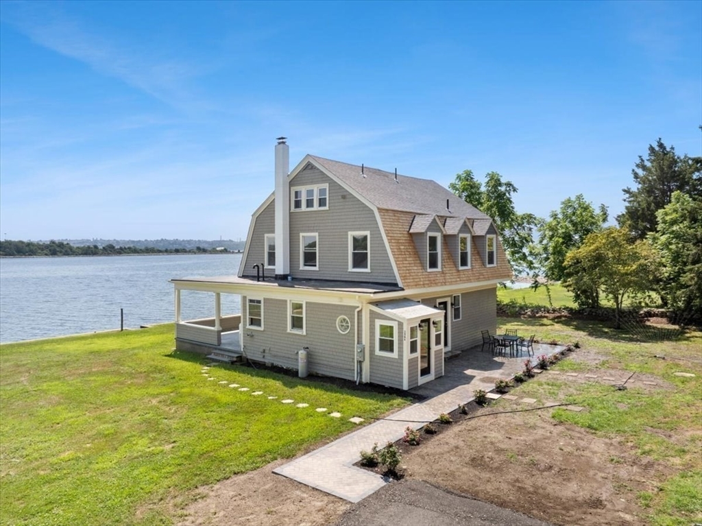 1366 Gardners Neck Road Swansea, MA 02777 - Photo 4 of 35 a view of a house with a ocean view