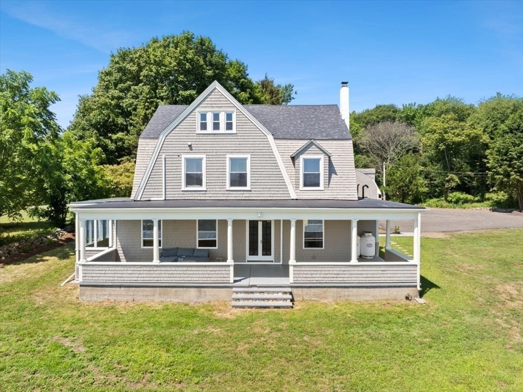 1366 Gardners Neck Road Swansea, MA 02777 - Photo 6 of 35 a house with trees in the background
