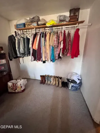 a view of storage and utility room with refrigerator