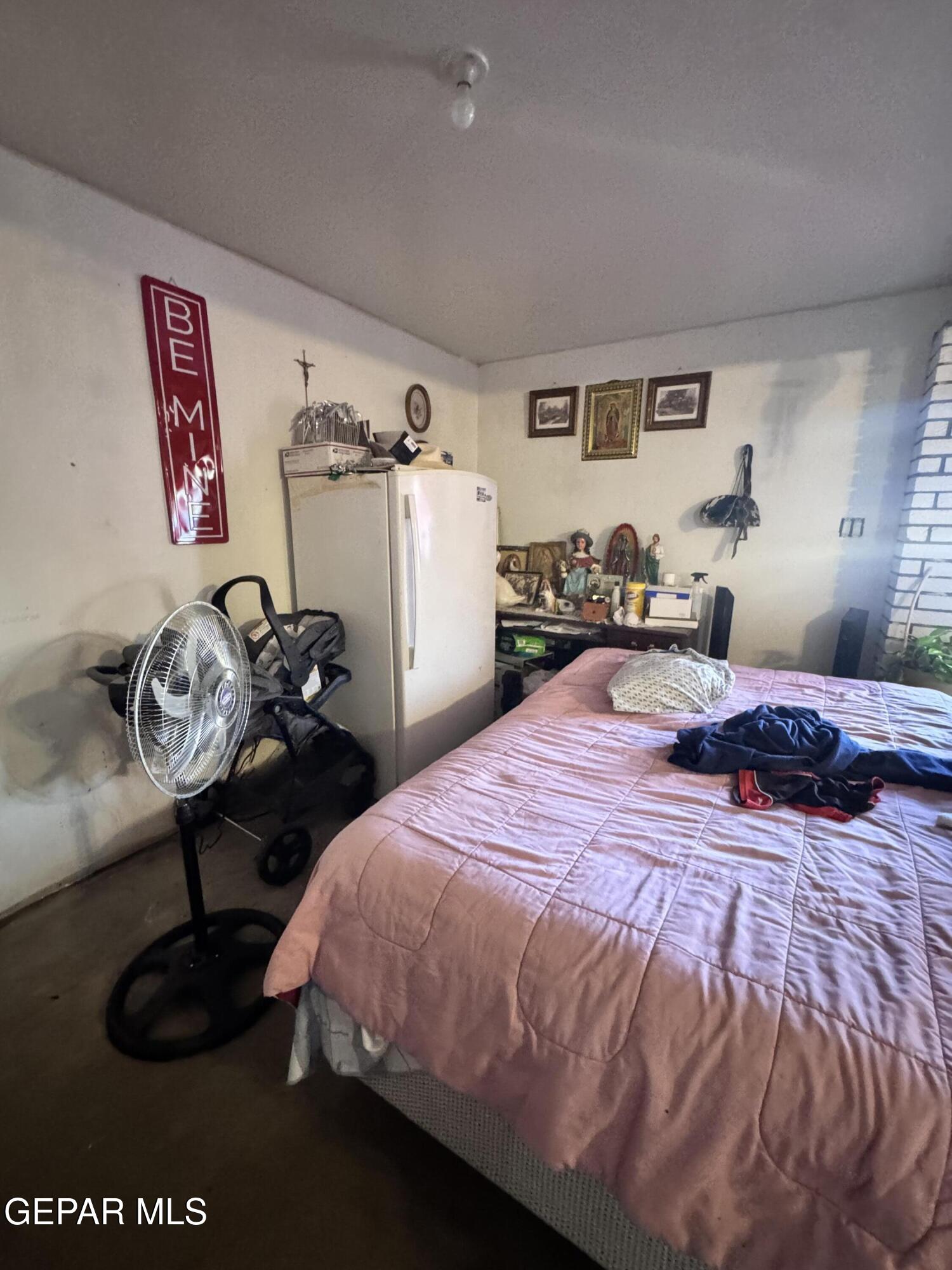 7045 1st Street Canutillo, TX 79835 - Photo 13 of 50 a bedroom with bed and a window