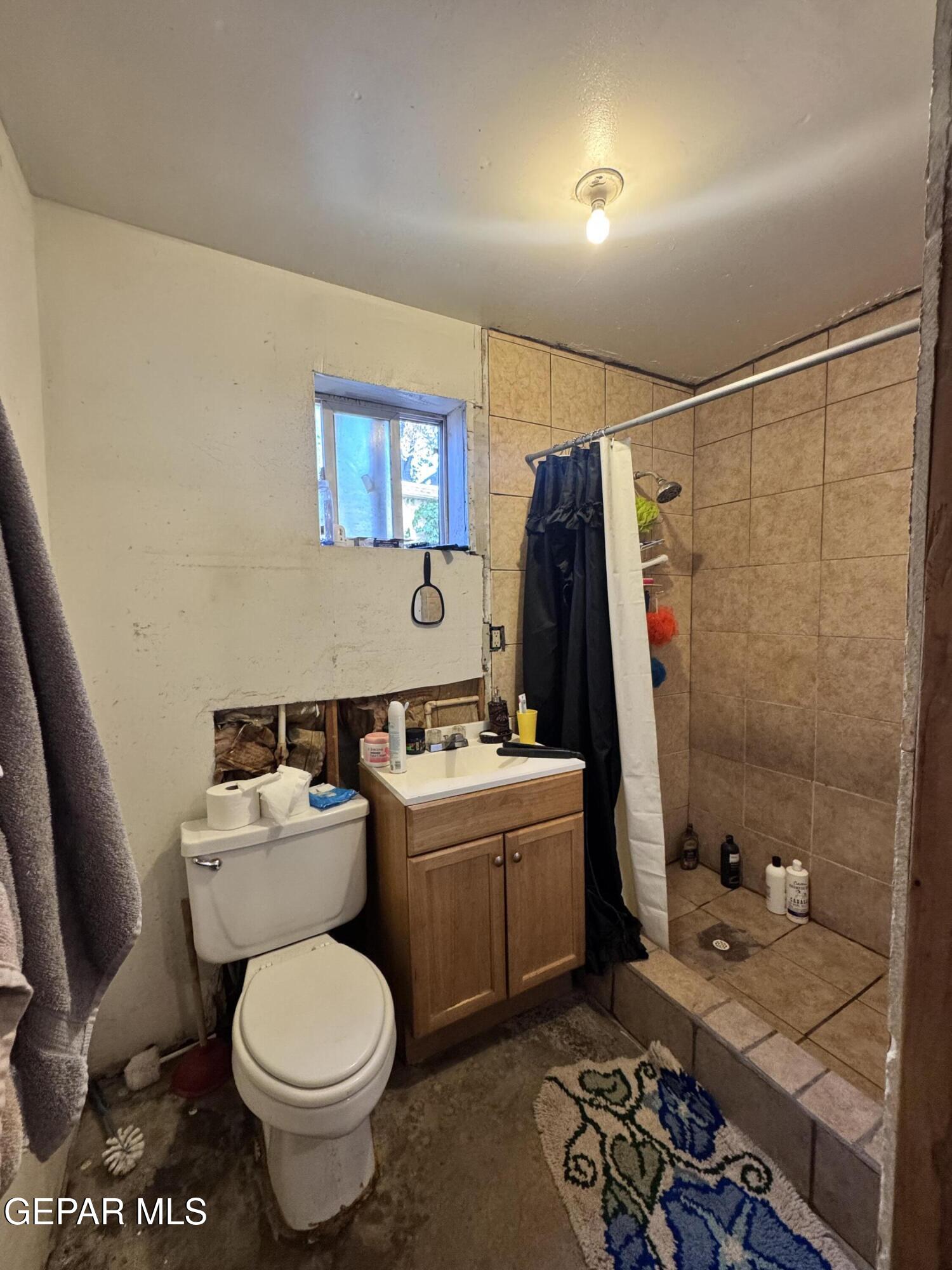 7045 1st Street Canutillo, TX 79835 - Photo 15 of 50 a bathroom with a sink toilet and shower