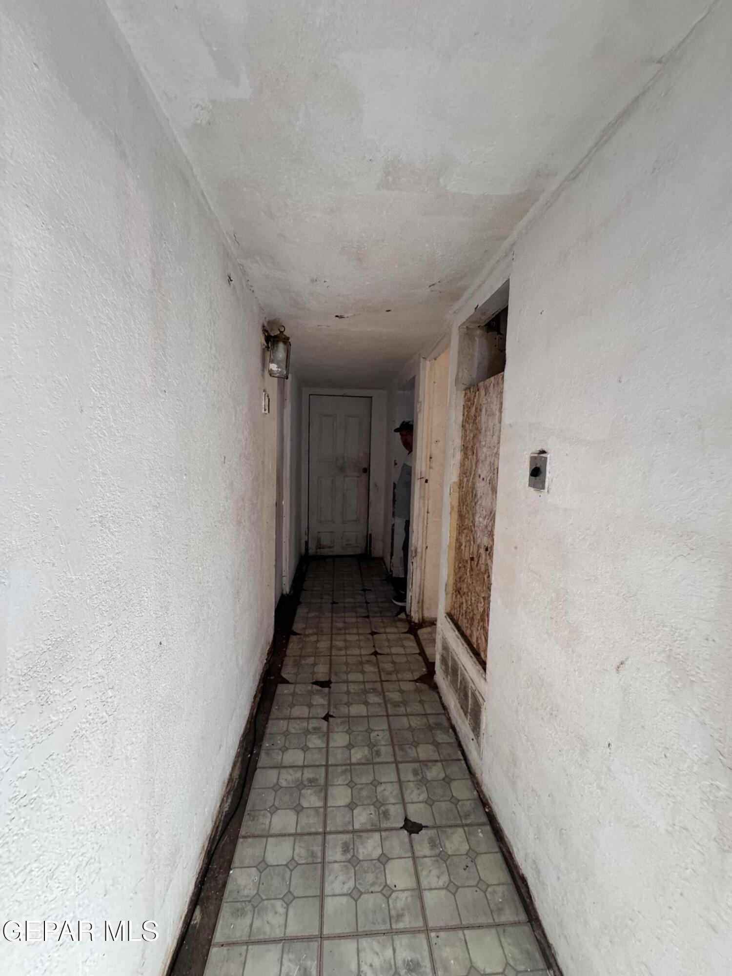 7045 1st Street Canutillo, TX 79835 - Photo 32 of 50 a view of a hallway with wooden floor and a bathroom