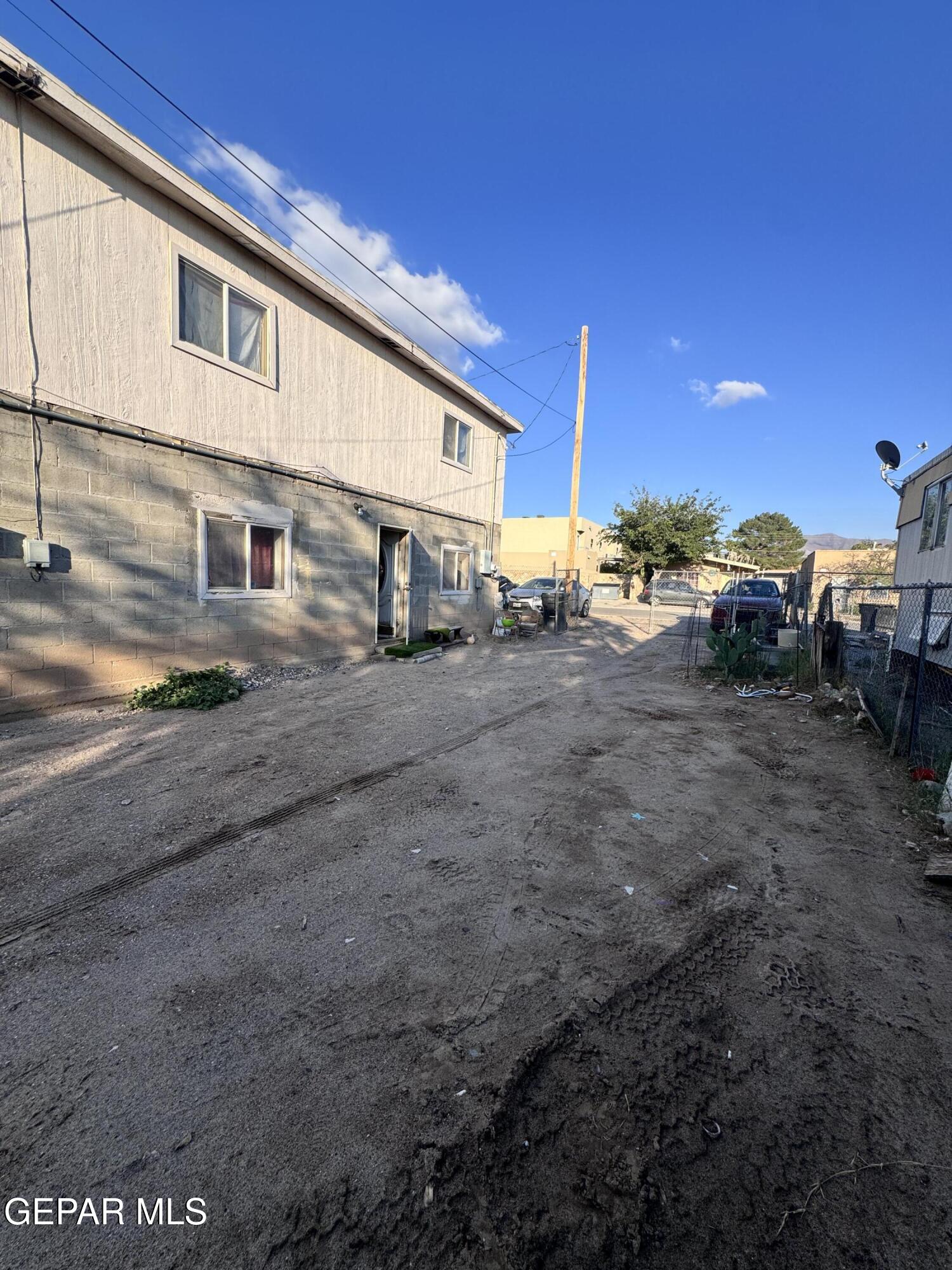 7045 1st Street Canutillo, TX 79835 - Photo 49 of 50 a view of a house with backyard and a car
