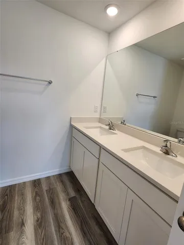 a bathroom with a sink and mirror