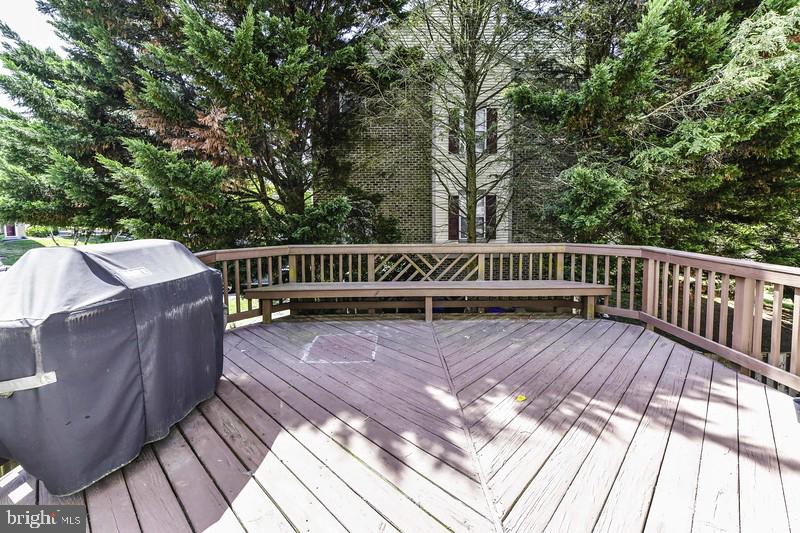 2 Parker Farm Court Silver Spring, MD 20906 - Photo 25 of 34 a view of a wooden deck with a bench