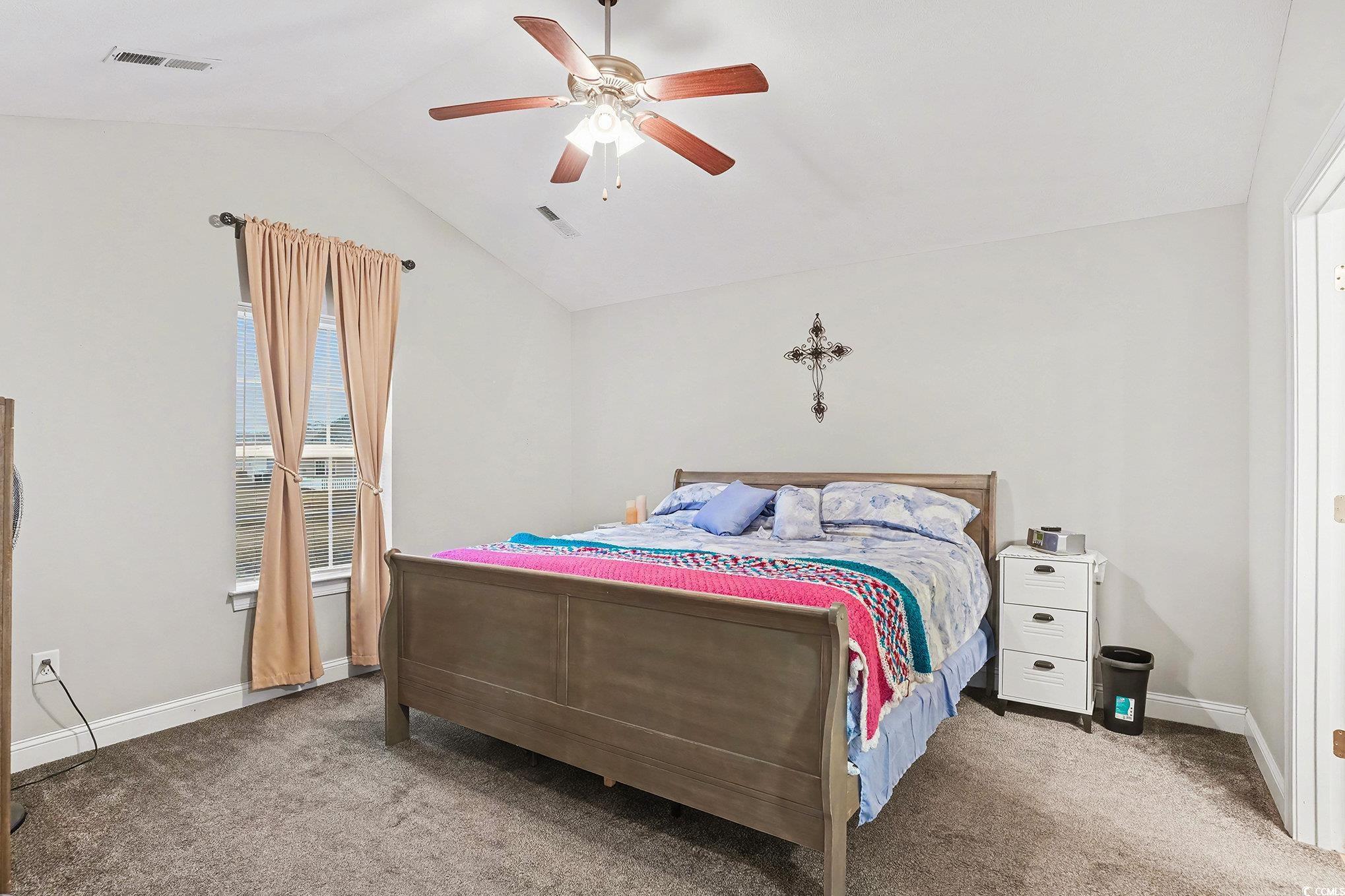 216 Camrose Way Myrtle Beach, SC 29588 - Photo 16 of 32 Bedroom with vaulted ceiling, ceiling fan, and carpet