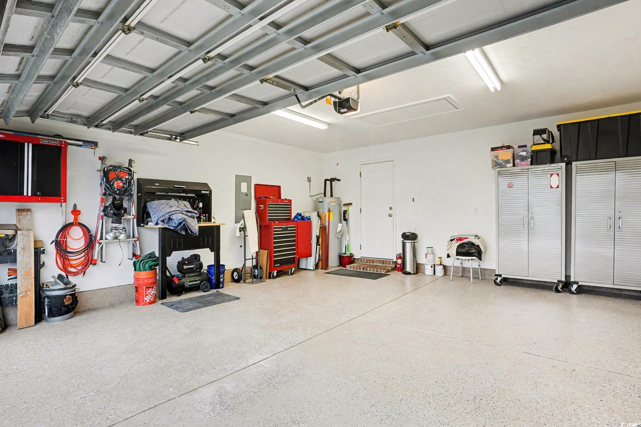 216 Camrose Way Myrtle Beach, SC 29588 - Photo 26 of 32 Garage featuring electric panel and water heater