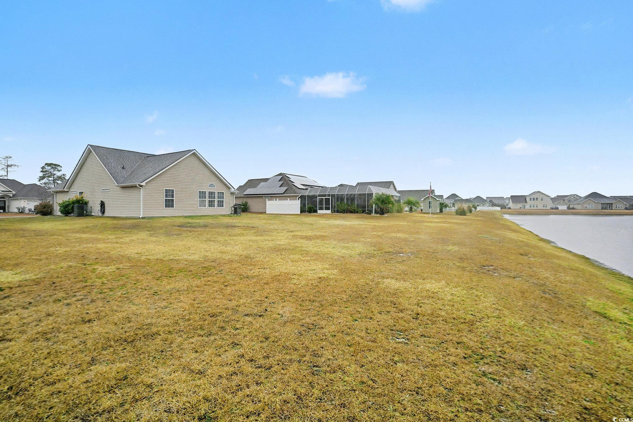216 Camrose Way Myrtle Beach, SC 29588 - Photo 28 of 32 View of green lawn featuring a residential view