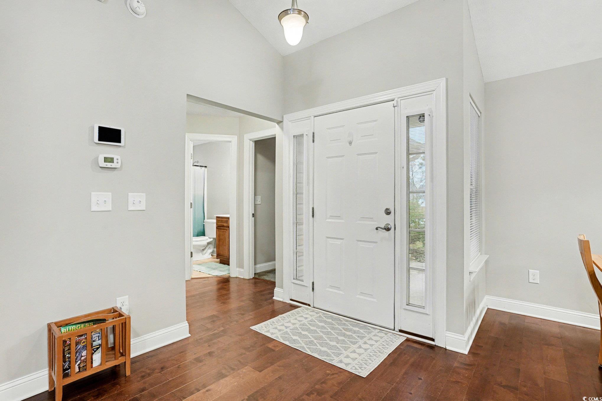 216 Camrose Way Myrtle Beach, SC 29588 - Photo 3 of 32 Foyer entrance with vaulted ceiling and dark wood finished floors
