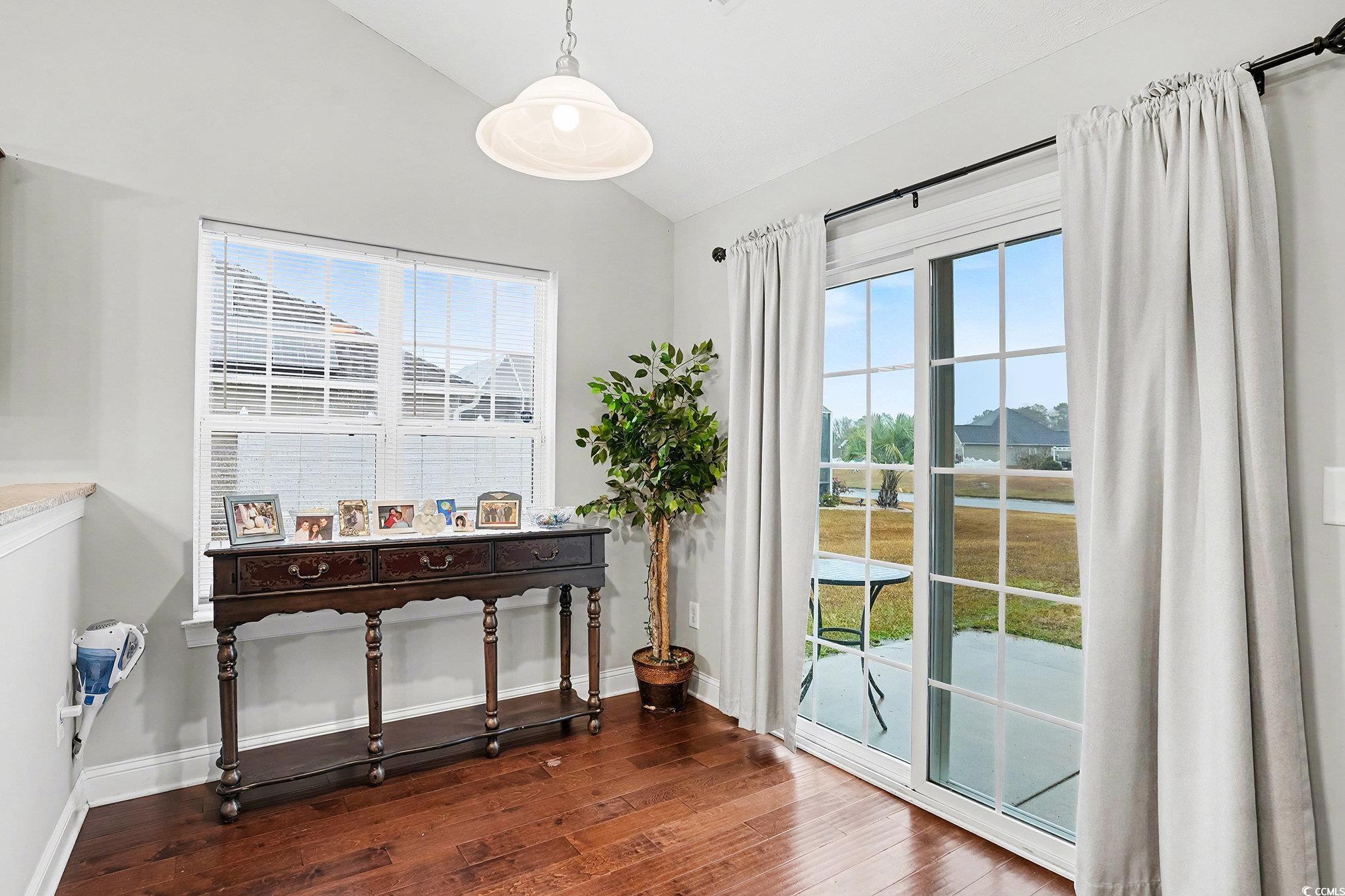 216 Camrose Way Myrtle Beach, SC 29588 - Photo 9 of 32 Doorway featuring lofted ceiling, plenty of natural light, and hardwood / wood-style flooring