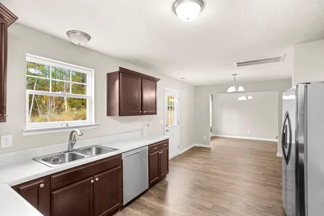 a bathroom with a sink double vanity granite and a large mirror
