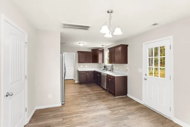 a large bathroom with a sink a mirror and a bathtub